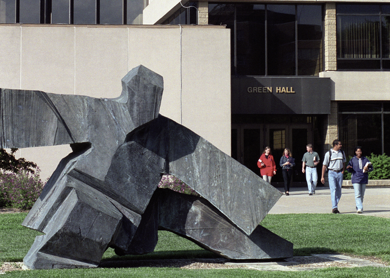 Tai Chi sculpture in foreground with Green Hall in background