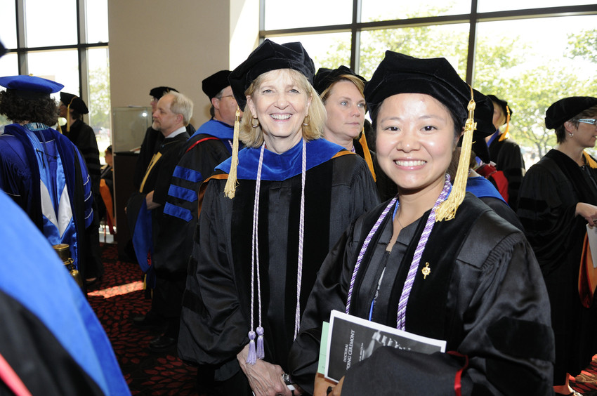 Doctoral students in graduation regalia