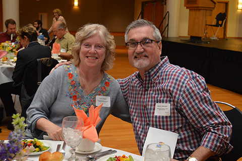 Lois Weldon, an administrative associate senior in the Bureau of Child Research, is preparing to retire after 41 years at KU. Distinguished Professor and Chair of the Department of Special Education Michael Wehmeyer, right, joins her at the Staff Retirement Luncheon.  